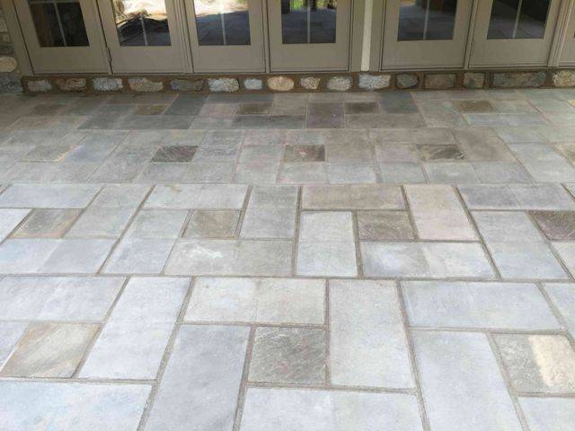 Light grey rectangular pavers in an interlocking pattern